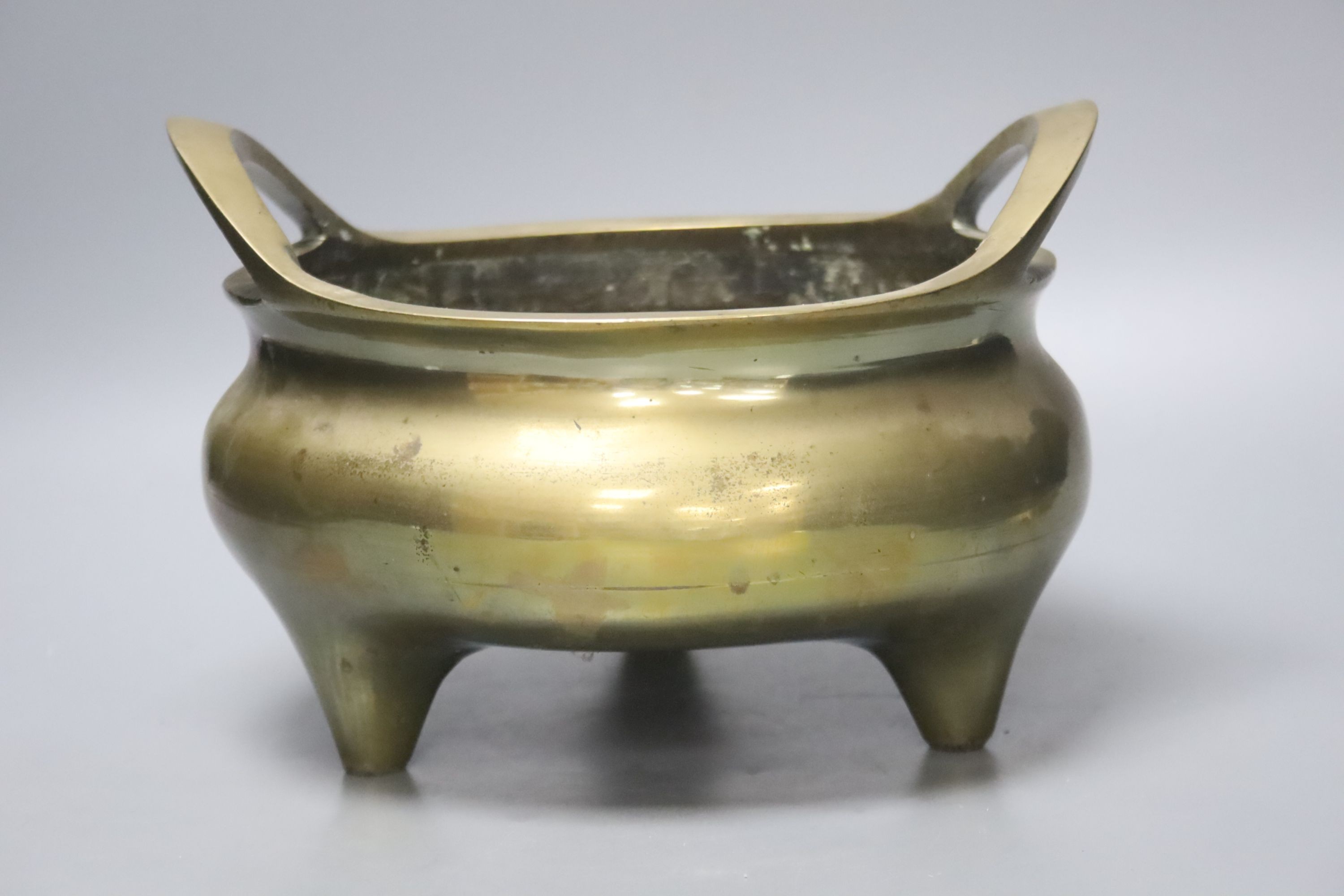 A large Chinese bronze tripod censer Xuande mark, early 20th century, 25cm wide